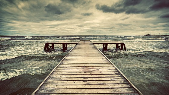 bigstock-Old-wooden-jetty-pier-during-66403051