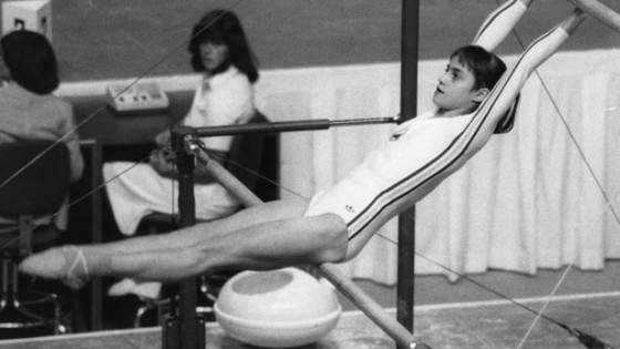 Romanian gymnast Nadia Comaneci on the asymmetric bars at the Olympic Games in Montreal.    (Photo by Frank Barratt/Getty Images)