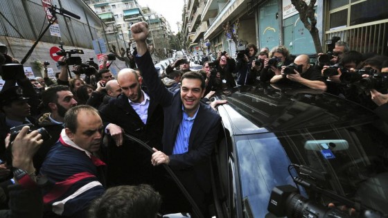 Opposition leader and head of radical leftist Syriza party Alexis Tsipras raises his fist as he leaves a polling station where he voted in Athens, Greece in this January 25, 2015 file photo.   REUTERS/Alexandros Stamatiou/PHASMA/Files