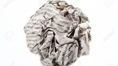 17519606-A-screwed-up-piece-of-newspaper-over-a-white-background--Stock-Photo